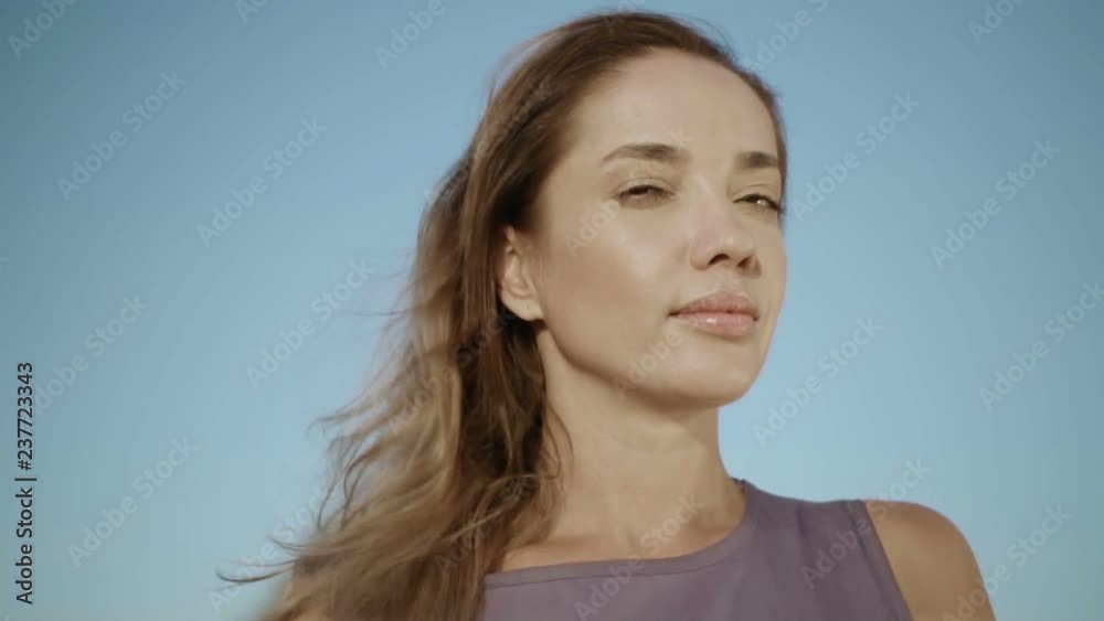 Young woman looking up into the sky. Portrait of a pensive girl Stress free concept. Slow motion Young woman looking up into the sky. Portrait of a pensive girl Stress free concept. Slow motion