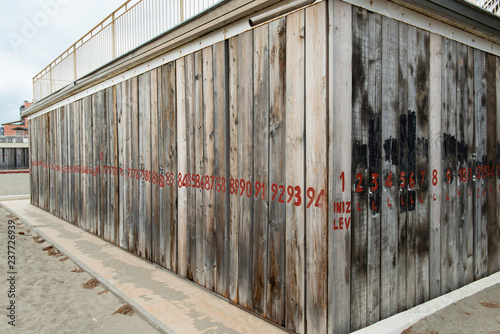 Wallpaper Mural Facades covered with wooden planks to protect against winter weather and storms of the sea, and by possible malicious thieves Torontodigital.ca