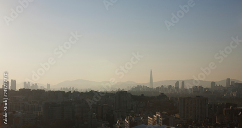 Hazy cityscape and skyline at dusk, Seoul, South Korea
