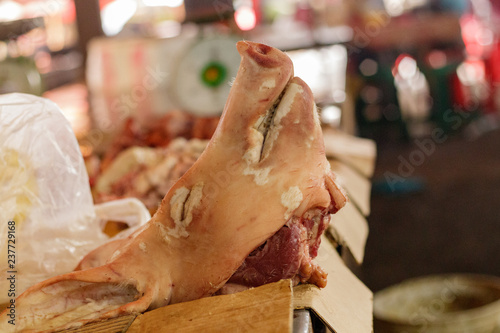 Slika na platnu Pig head for sale in a market in Cambodia