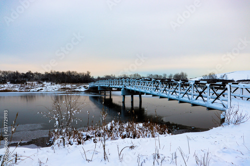 Bridge over frozen lake in winter