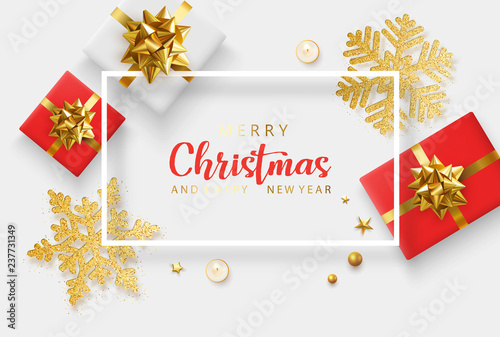 Merry Christmas and Happy New Year card with red top view gifts and golden snowflakes.