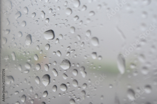 Rain, water droplets on the glass.