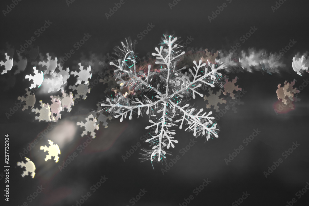 snowflake on colorful bokeh background, snowflake with blurred background.