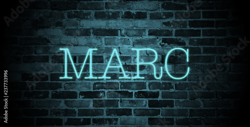 first name Marc in blue neon on brick wall photo