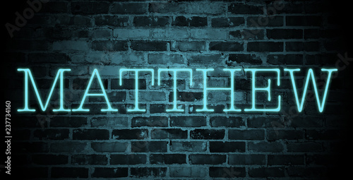 Obraz na płótnie first name Matthew in blue neon on brick wall