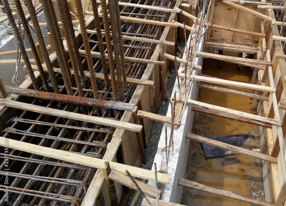 Ground beam timber form work constructed by workers at the construction site. Ground beam timber form work constructed by workers at the construction site.