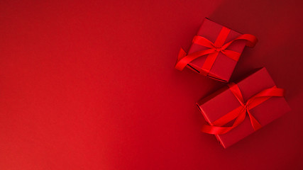 Merry Christmas and Happy Holidays greeting card, frame, banner. New Year. Christmas gifts, presents on red background. Winter holiday theme.