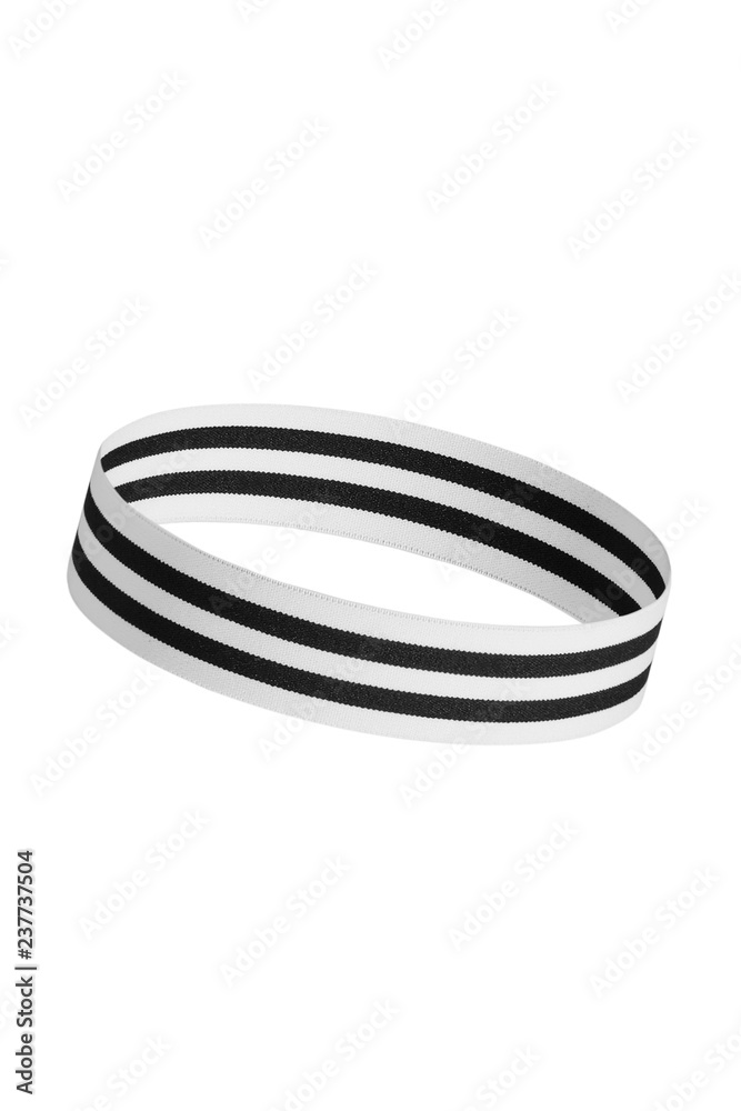 Close up shot of a tilted hair band for jogging and fitness. Round-shaped training headband with stripes, isolated against the white background. Trendy athletic headwear. Sporty hair accessories. Close up shot of a tilted hair band for jogging and fitness. Round-shaped training headband with stripes, isolated against the white background. Trendy athletic headwear. Sporty hair accessories.