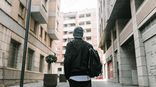Rear view of man walking on street