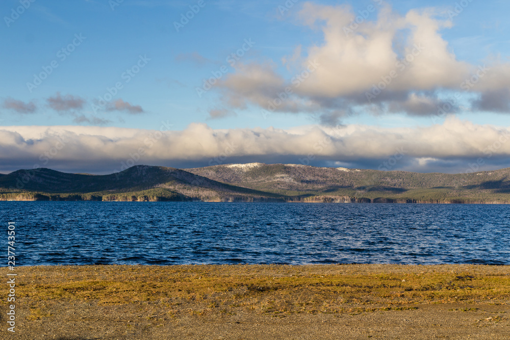 lake landscape with mountains and clouds