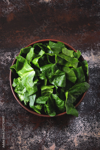 Bowl with chopped spinach. Flat lay.