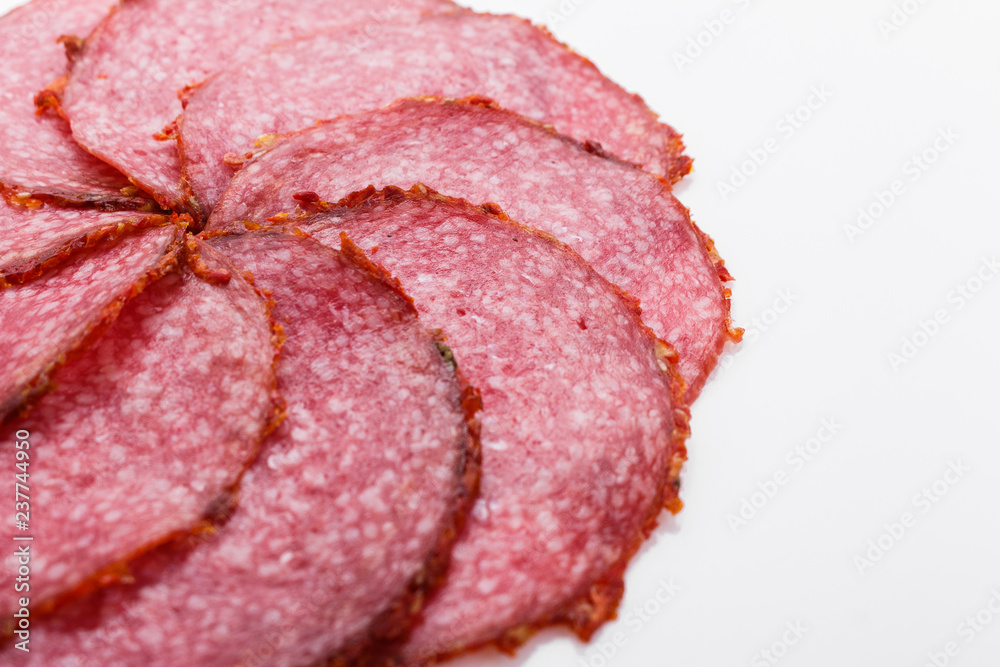 delicious sliced salami on a white background