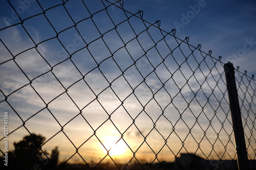 wire fence on sunset background