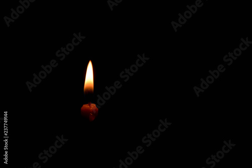 Fire light from candle isolated on black background