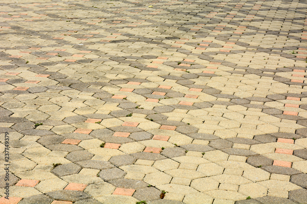 Fototapeta premium patterned paving tiles, old cement brick floor background