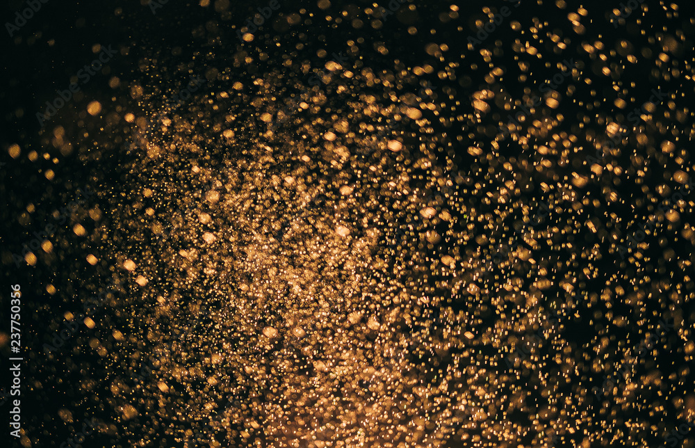 gold bokeh abstract backgrounds. image is blurred and filtered.
