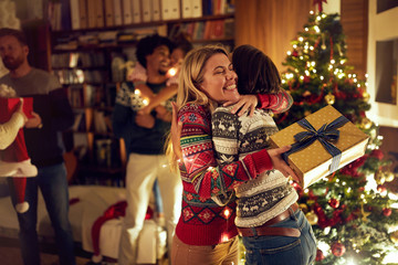 happy girlfriends celebrating Christmas together.
