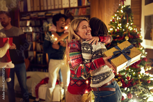 happy girlfriends celebrating Christmas together.