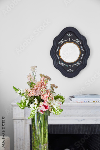 Flowers and mirror in bedroom