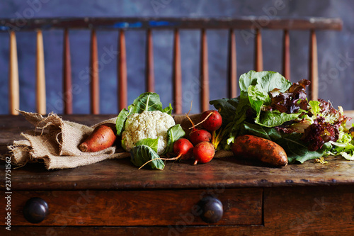 Still life with vegetables on rustic wooden table