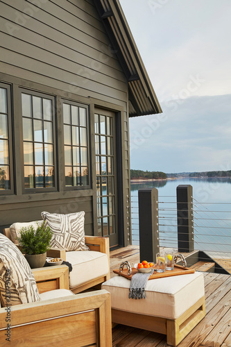 Wooden house with terrace over lake