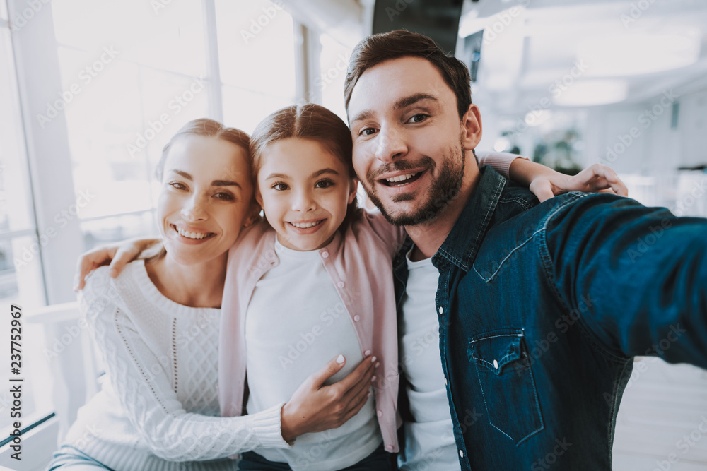 Young Family is Doing Selfie in Cafe Young Family is Doing Selfie in Cafe