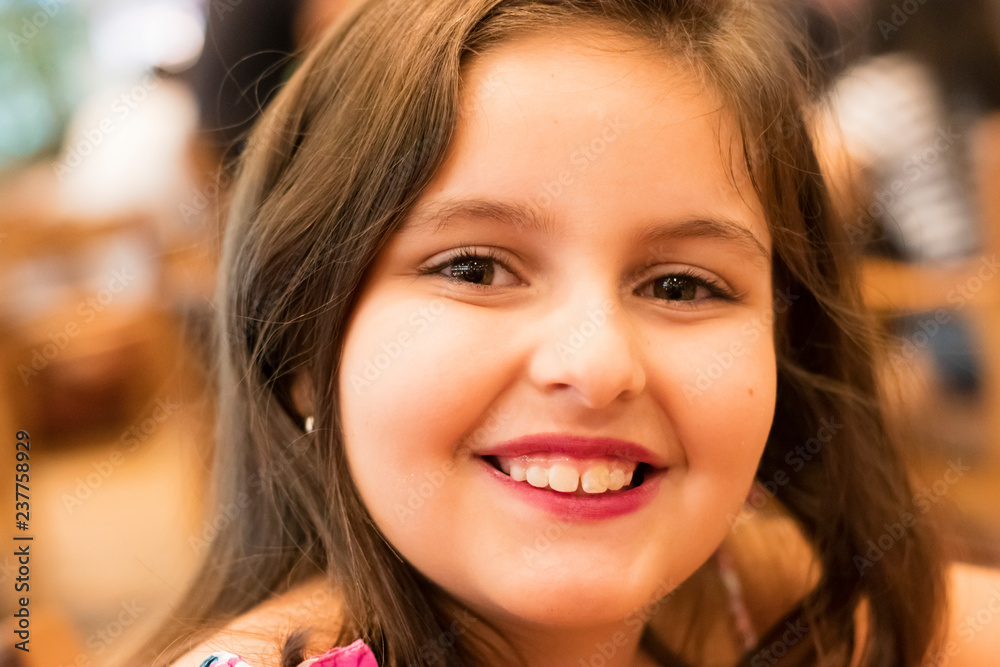 Fototapeta premium close-up on face of child girl smiling