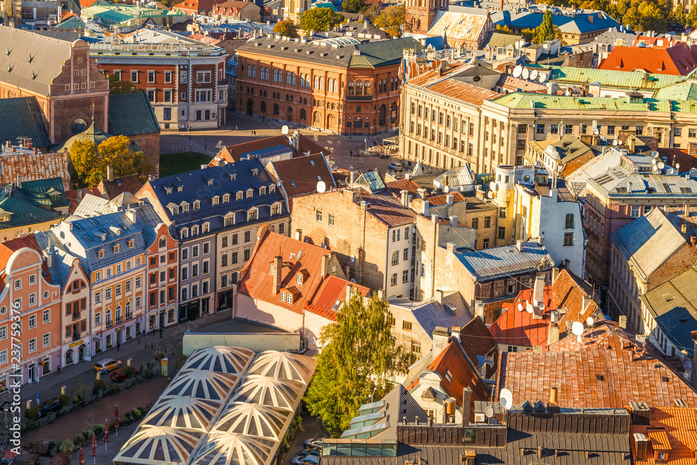 Riga, Latvia. Amazing view from the tower of St. Peter's Church to the old historical center of the city, amazing colourful roofs of old houses. Colorful cities concept. Travel Europe. 