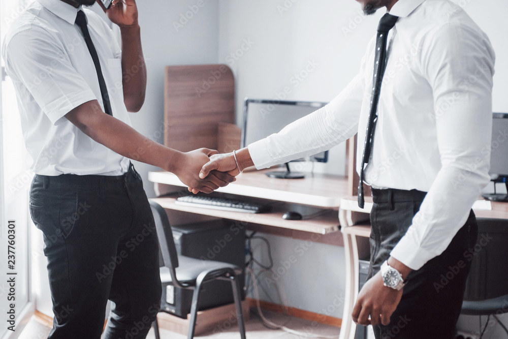 Obraz premium Business partnership concept. Photo of two businessman handshaking process. Successful deal after great meeting