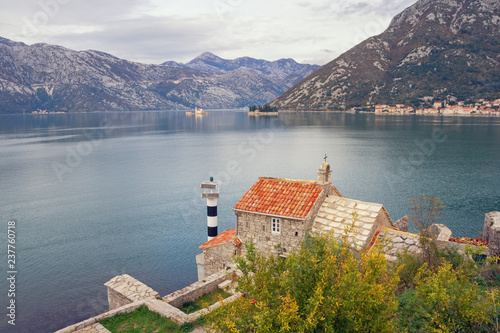 Picturesque Mediterranean landscape on cloudy autumn day. Montenegro, Adriatic Sea. View of Bay of Kotor, Church of Our Lady of the Angels and two small islands