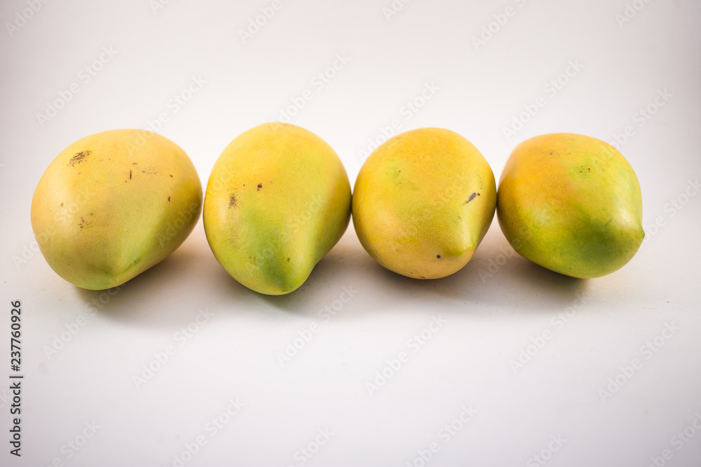 Four vietnamess mangoes on white background Four vietnamess mangoes on white background