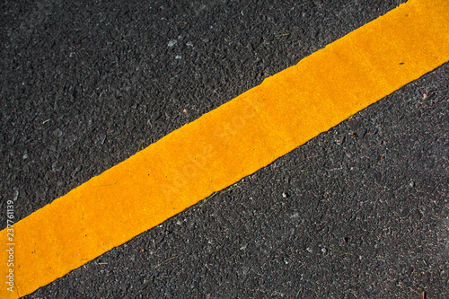 yellow line on the road texture background © jukree