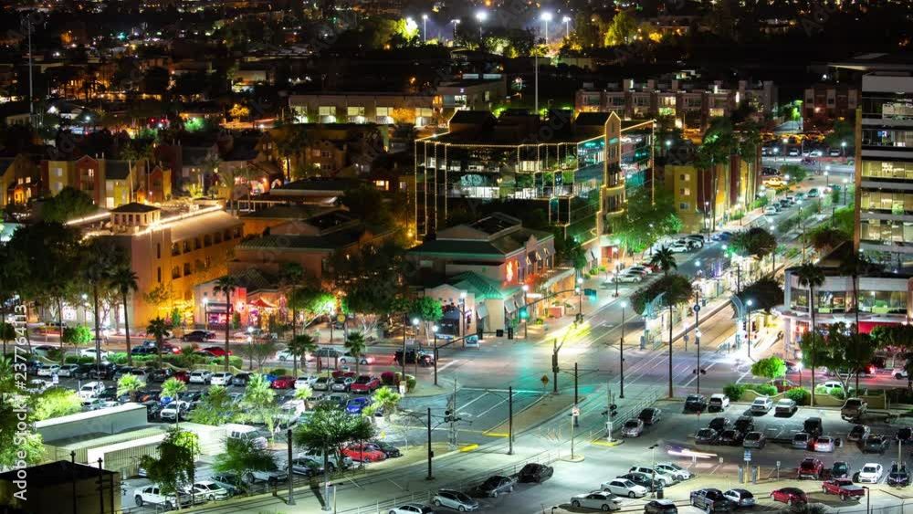 Tempe AZ Generic Night Timelapse of the City Center with Streaking Lights from Moving Traffic around a Vibrant Intersection Scene of the Arizona College Town