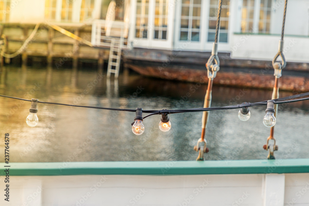 Obraz premium Details of wooden boat and light bulbs line. Copenhagen, details