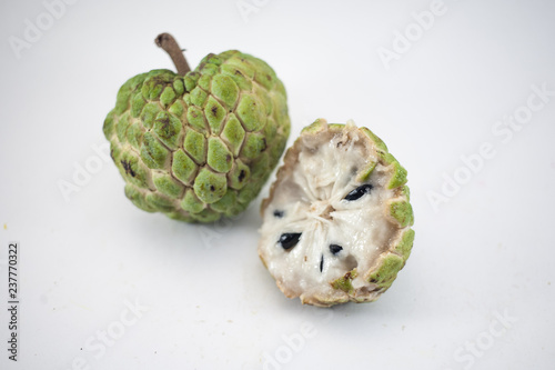 Sugar apple or custard apple with slice isolated on white background, exotic tropical Thai annona or cherimoya fruit