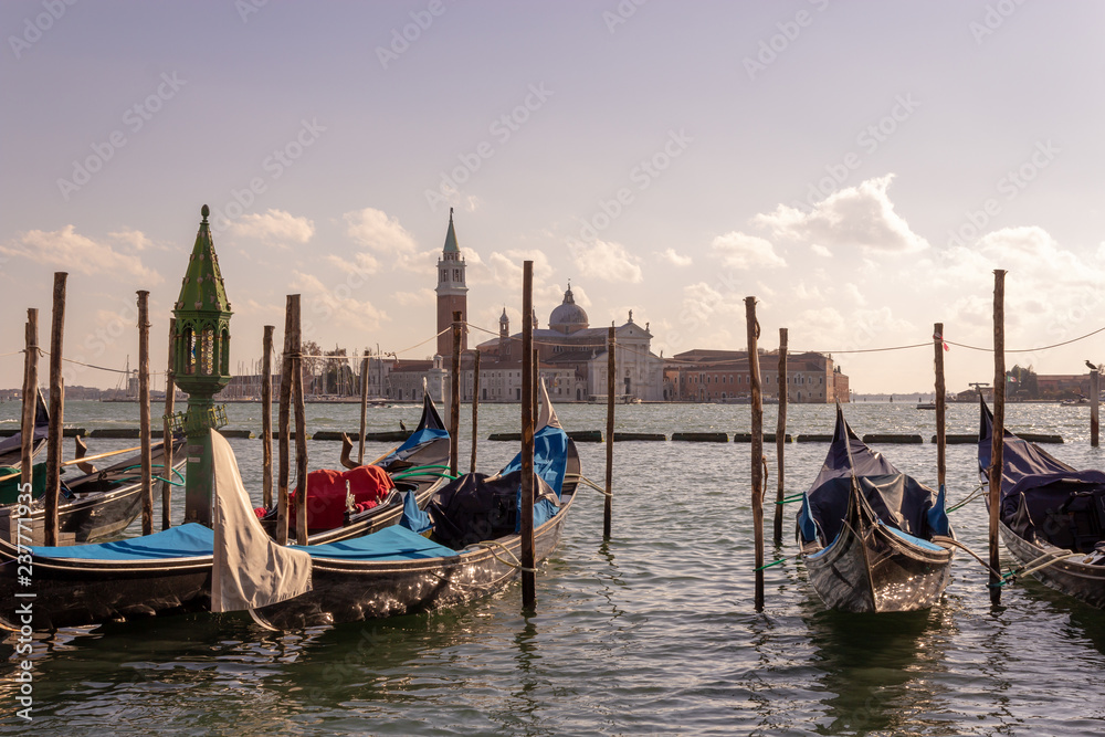 Venice, gondola on the background of the city