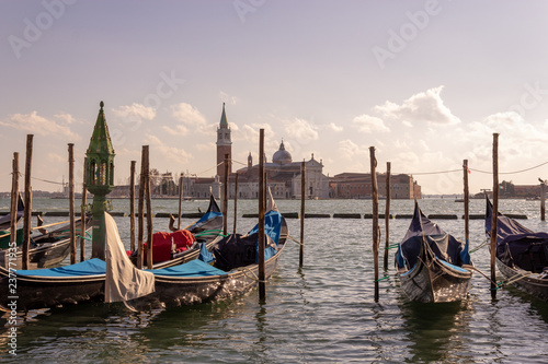 Venice, gondola on the background of the city © Anna
