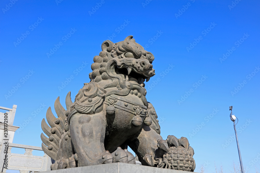 giant lion sculptures under blue sky, tangshan city, China