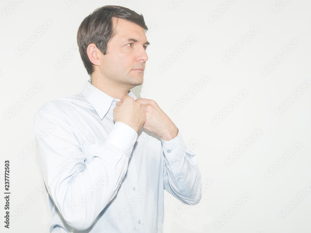 Man getting ready to dress and business meeting. isolated on a grey background Man getting ready to dress and business meeting. isolated on a grey background