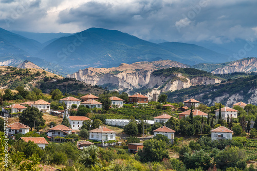 View of Bulgarian ski resort Bansko at summer time, peaks of Pirin mountains in the background. photo