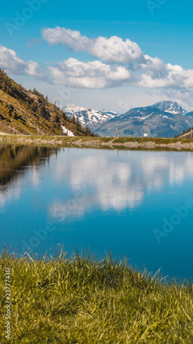 Fototapeta Naklejka Na Ścianę i Meble -  Smartphone HD wallpaper of beautiful alpine view with reflections at Leogang - Tyrol - Austria