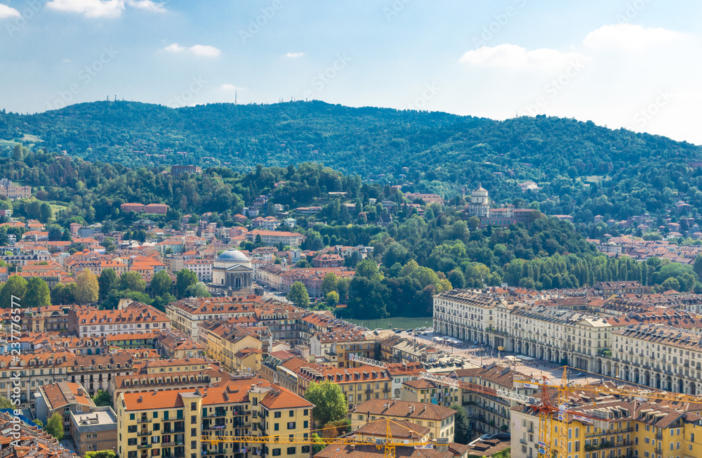 Aerial top panoramic view of Turin Torino city historical centre, Piazza Vittorio Veneto square, old buildings and Catholic Parish Church Chiesa Gran Madre Di Dio and green hills, Piedmont, Italy