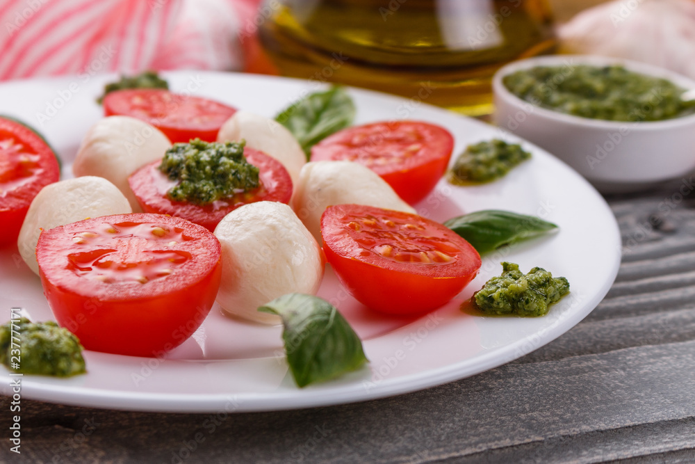 Caprese salad on a wooden rustic background Caprese salad on a wooden rustic background