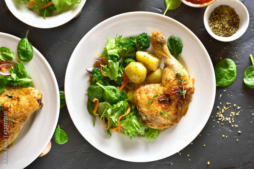 Baked chicken leg with potato and green salad Baked chicken leg with potato and green salad
