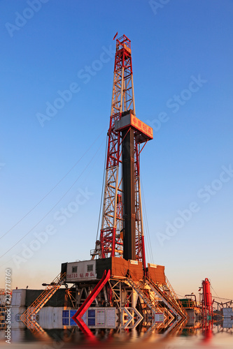 oil drilling derrick, jidong oilfield, caofeidian, hebei, China photo