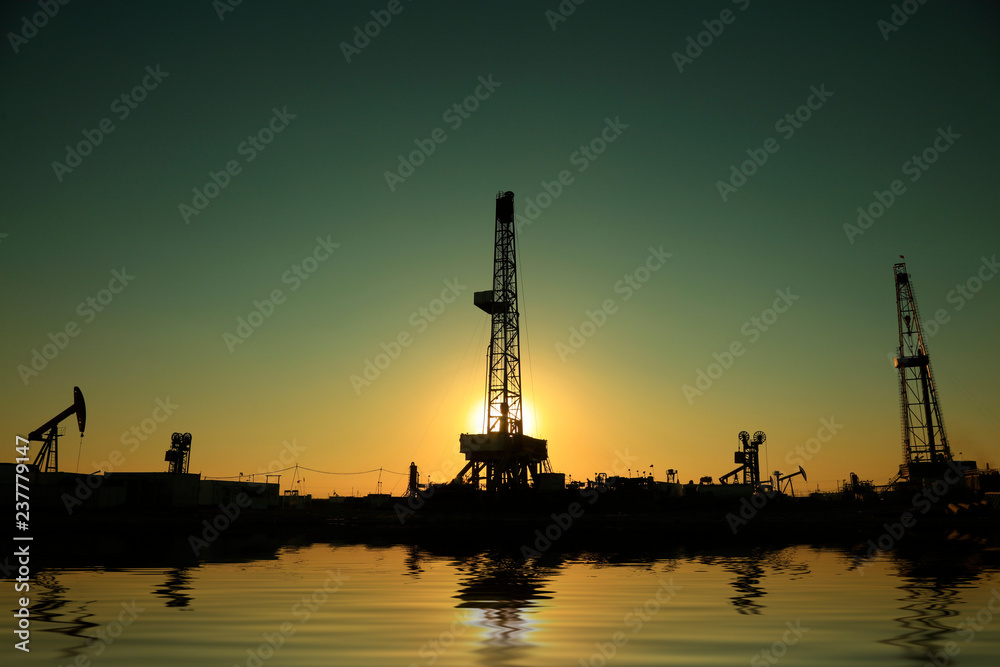 Oil drilling derrick in oilfield