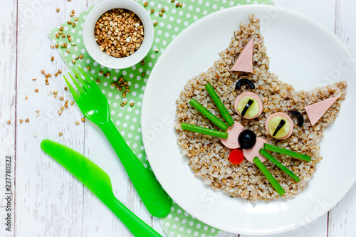 Healthy breakfast for kids - buckwheat porridge shaped cute cat, animal face food idea