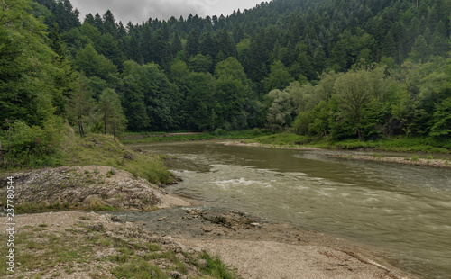 Dark grey morning near Lesnicky creek and Dunajec river confluence photo