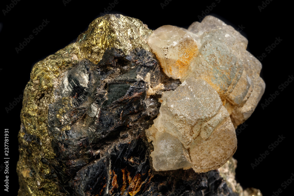 Macro of a mineral stone Sphalerite with fluorite and pyrite on a black background close up